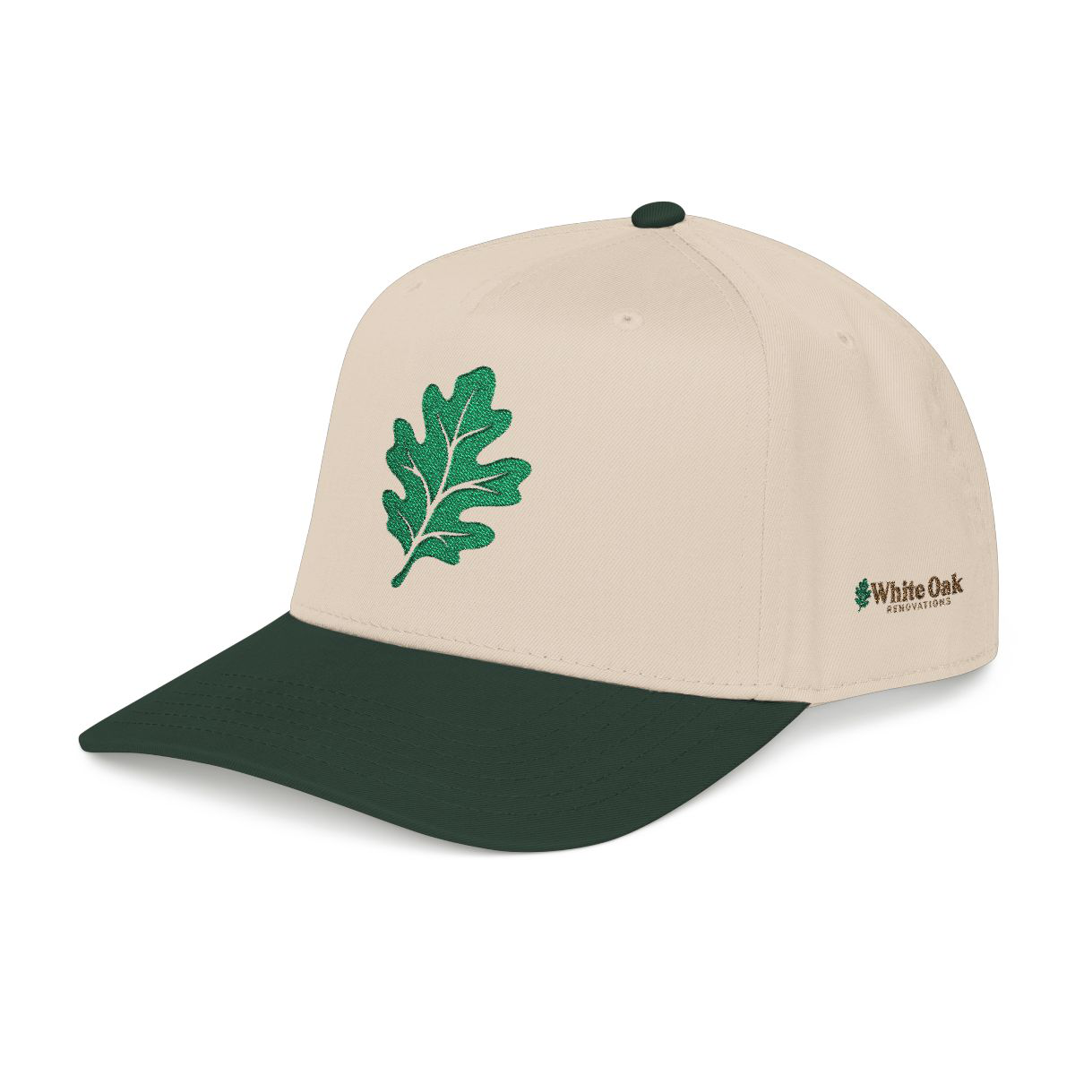 Ivory and oak-green cap with an embroidered leaf on the crown